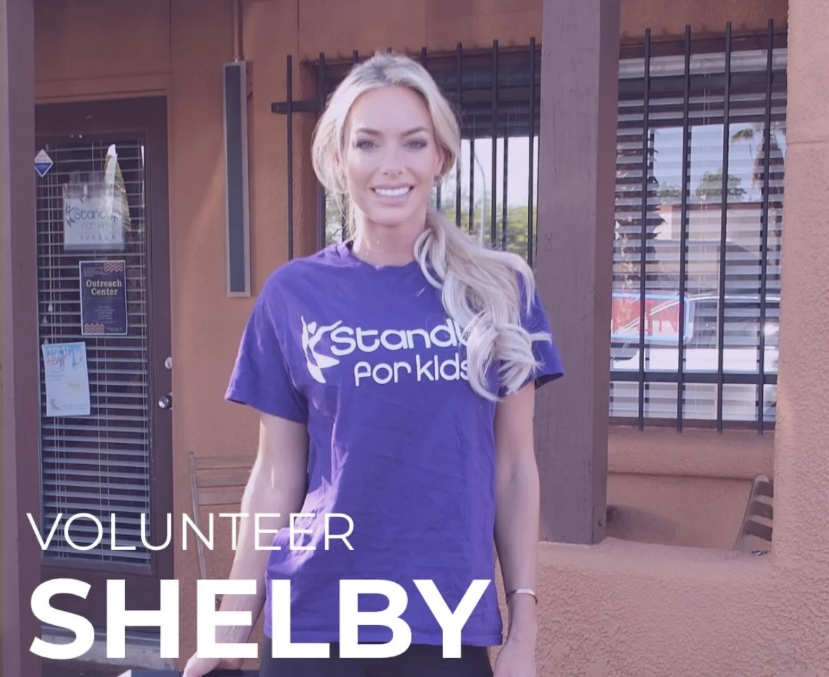 Shelby Korpi in a StandUp for Kids volunteer shirt outside the Tucson Outreach Center.