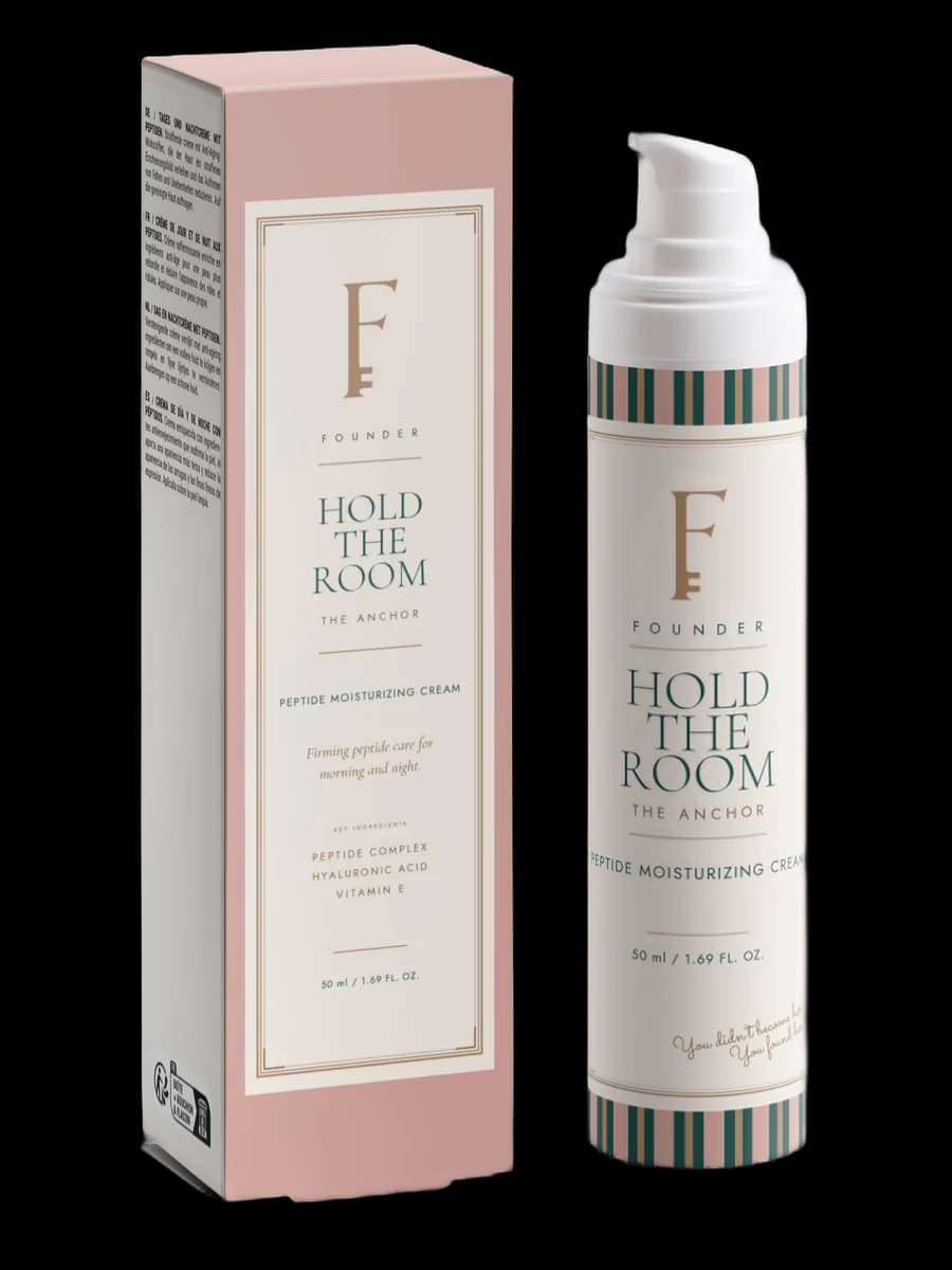 Hold the Room peptide moisturizing cream: a Desert Pink airless bottle beside its carton.