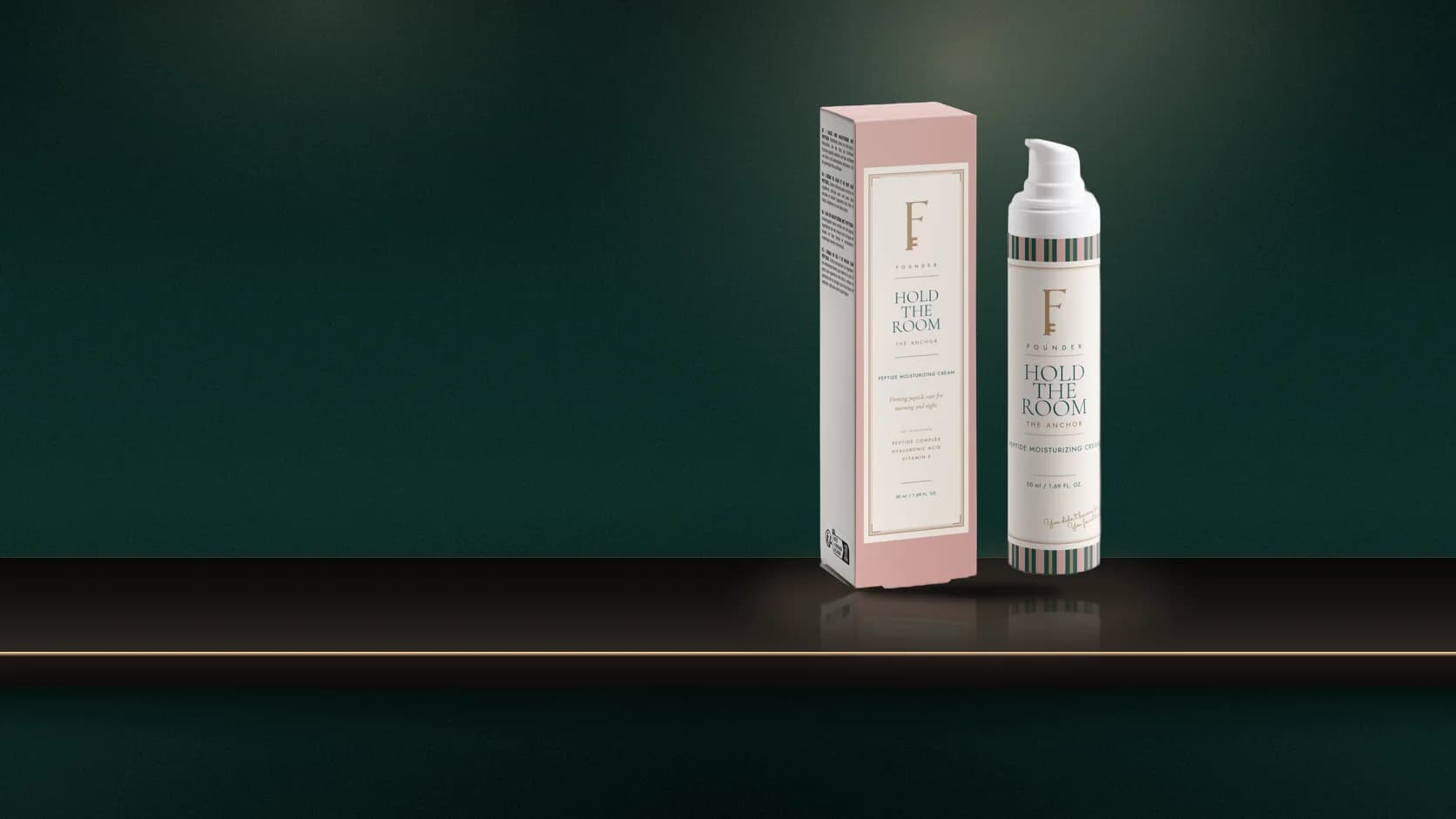 Hold the Room and its carton on a dark marble console, a woman in cream buttoning her jacket in the mirror, the boardroom lit beyond the open doors.